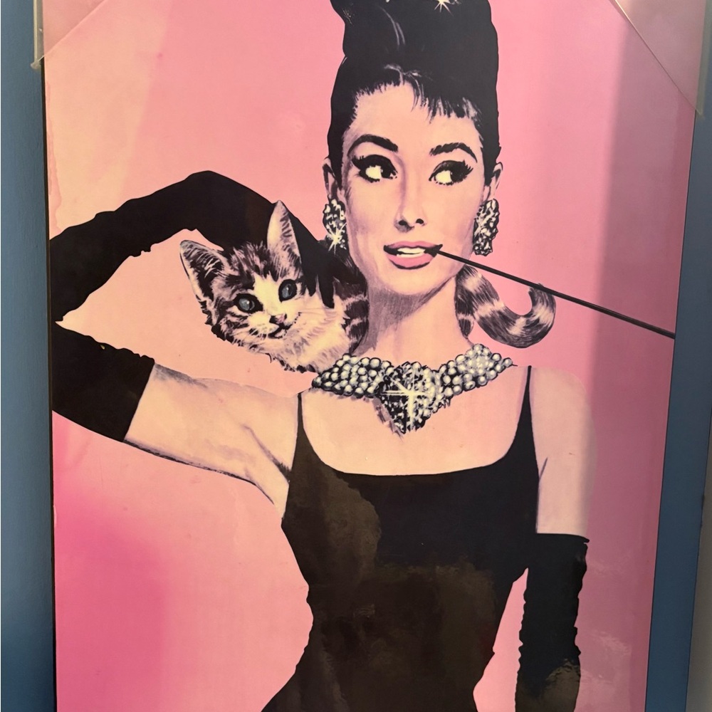 Iconic print and frame of Audrey Hepburn in her role as Holly Golightly